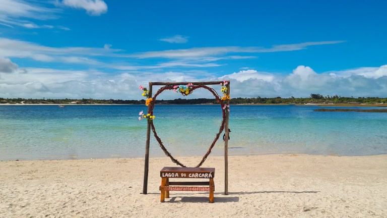 August 2021. Sky, lagoon, people, hammock and sand. Lagoa do Carcará, Natal Brazil.